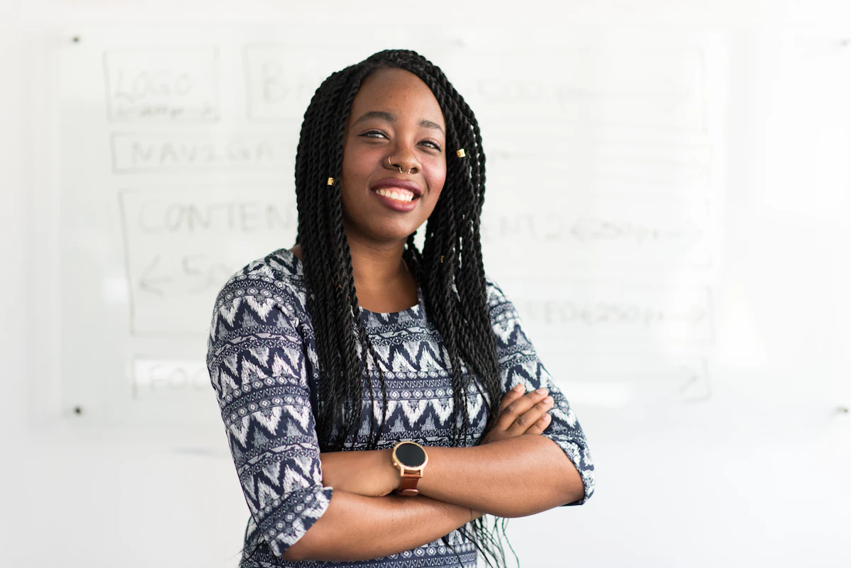 A confident professional woman with arms folded